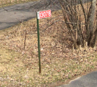 red and white address sign